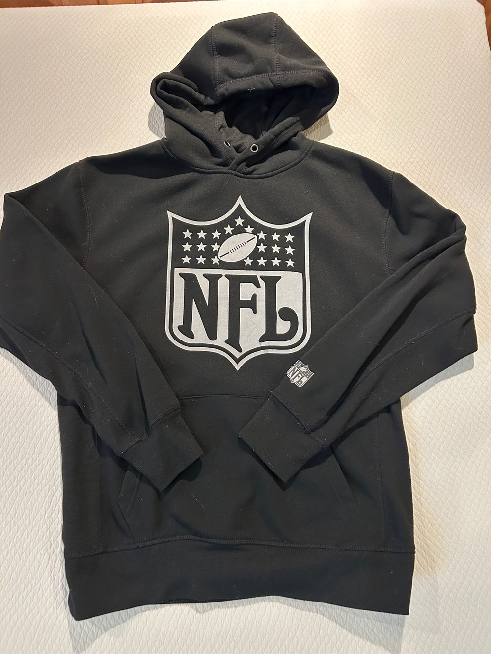 Men’s NFL Black Pullover Hoodie with White Shield Logo, Size S